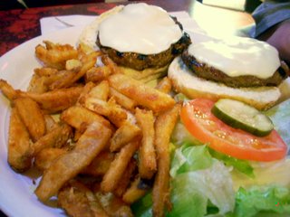 dscn20641 Charlie's Kitchen: A Guinness-soaked double cheeseburger for my devoutly sober, Catholic friend. "It gives it an interesting taste," he said. I couldn't really detect much of a difference, and definitely no beer flavor, although I only had a tiny bite and made off with a bunch of his french fries.