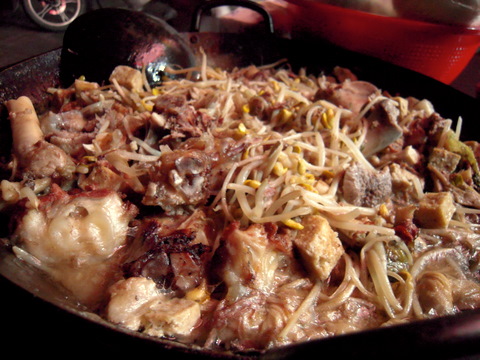 A soup made from boiled leftover lamb bones for many hours, combined with tofu and some other vegetables. I mix it with some extra chili and soak up the excess with mantou.